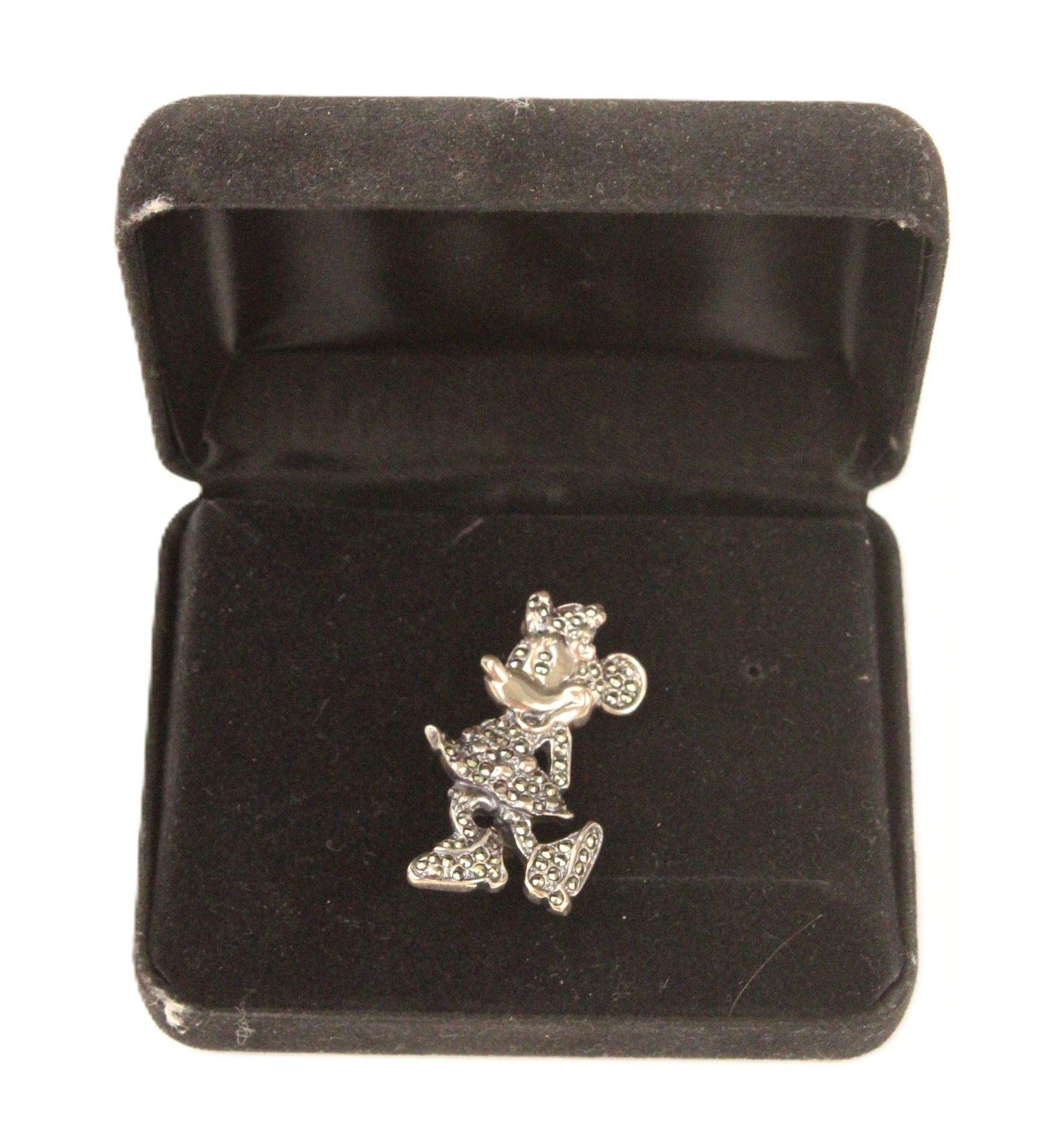 A Vintage Minnie Mouse Silver Brooch.: This is a silver brooch of Minnie Mouse with crystals throughout. It comes in its original box.