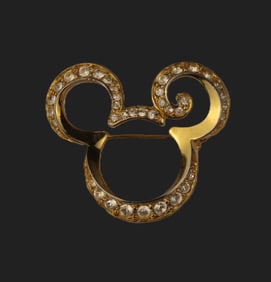 A Gold-toned Stylized Swarovski Crystal Mickey Icon Brooch.