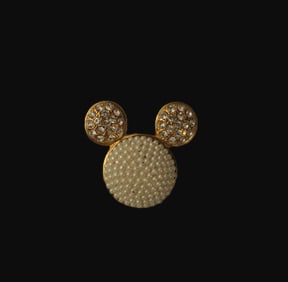 A Pearl and Swarovski Crystal Mickey Head pin.