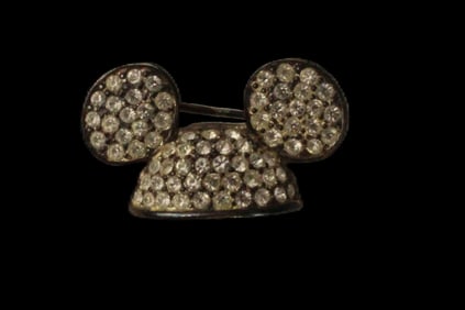 A Gold-toned Mickey Ear Hat Broach with Swarovski Crystals.