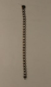 A Gold-toned Sterling Silver Mickey Mouse Icon 7.5? Tennis Bracelet with Swarovski Crystals.
