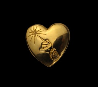 The Variety Club Gold Heart Pin.