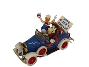A Metal Donald and Goofy In Roadster.