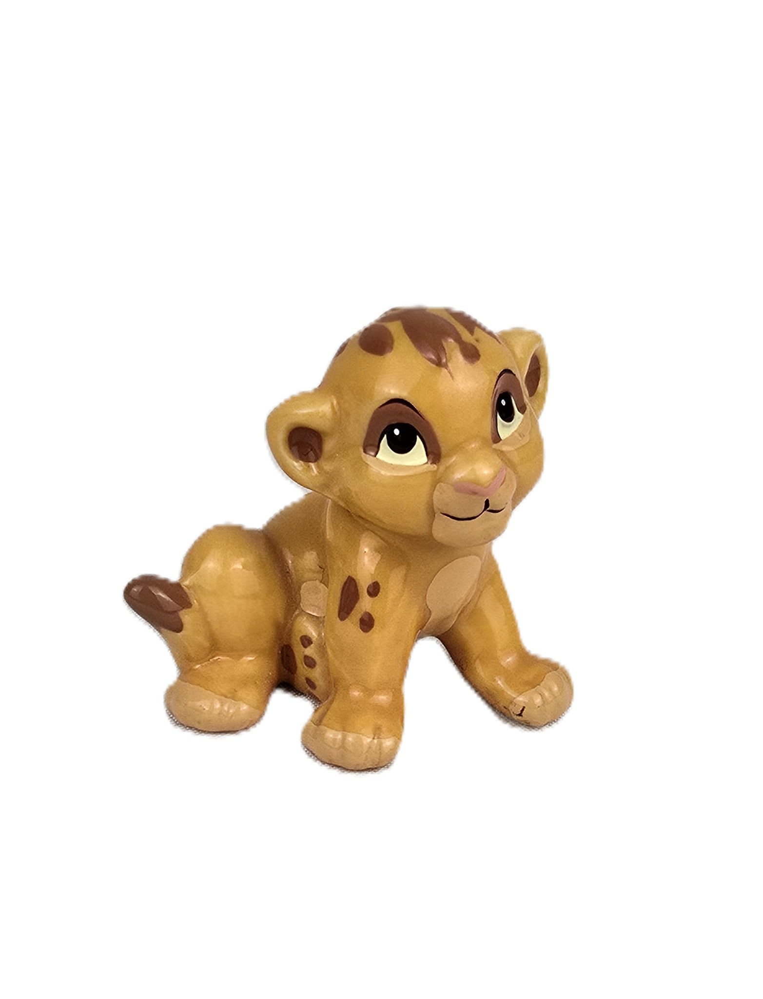A Bone China Simba Figurine.: (Disney) This is a figure of baby Simba from the Disney animated classic, The Lion King. crafted in Japan of Bone China. It measures 1.5? tall and is in excellent condition.