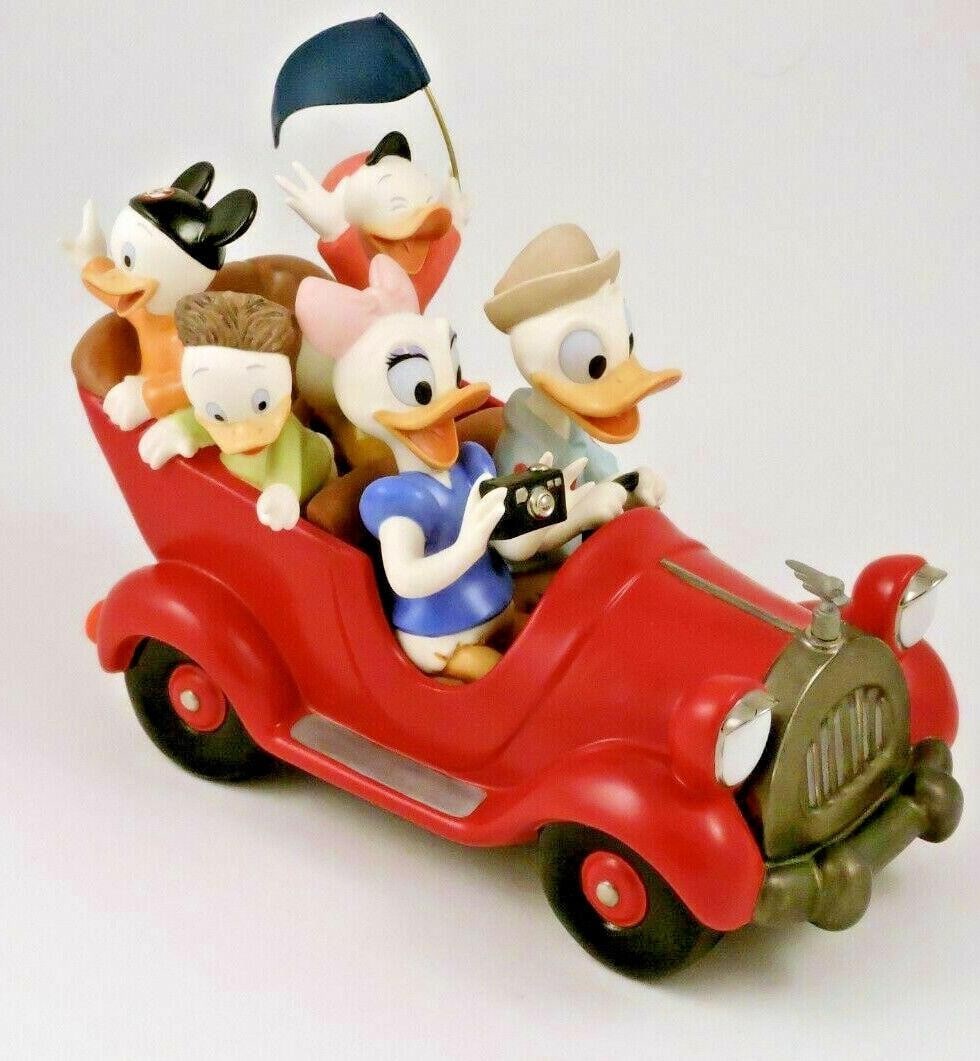 WDCC Donald, Daisy and Donald's Nephews "Family Vacation".: (WDCC, 2005) Crafted by Bruce Lau, this piece features Donald's classic red roadster (inspired by the auto seen in the last Donald Duck theatrical cartoon produced to date, 'The Litterbug') is complet