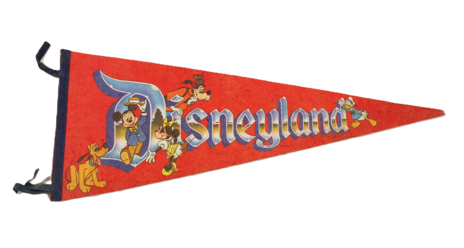 A Vintage Red Disneyland Pennant.: (Disneyland, 1980s) A red Disneyland character pennant. This pennant features Disney characters such as Mickey, Minnie, Goofy, Donald, and Pluto. This pennant measures 11.25"x28.5" and is in good cond