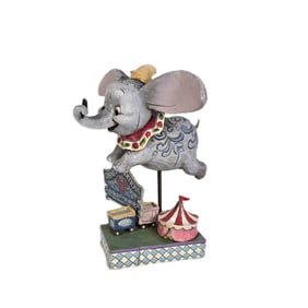 A Disney Traditions Dumbo Figurine.