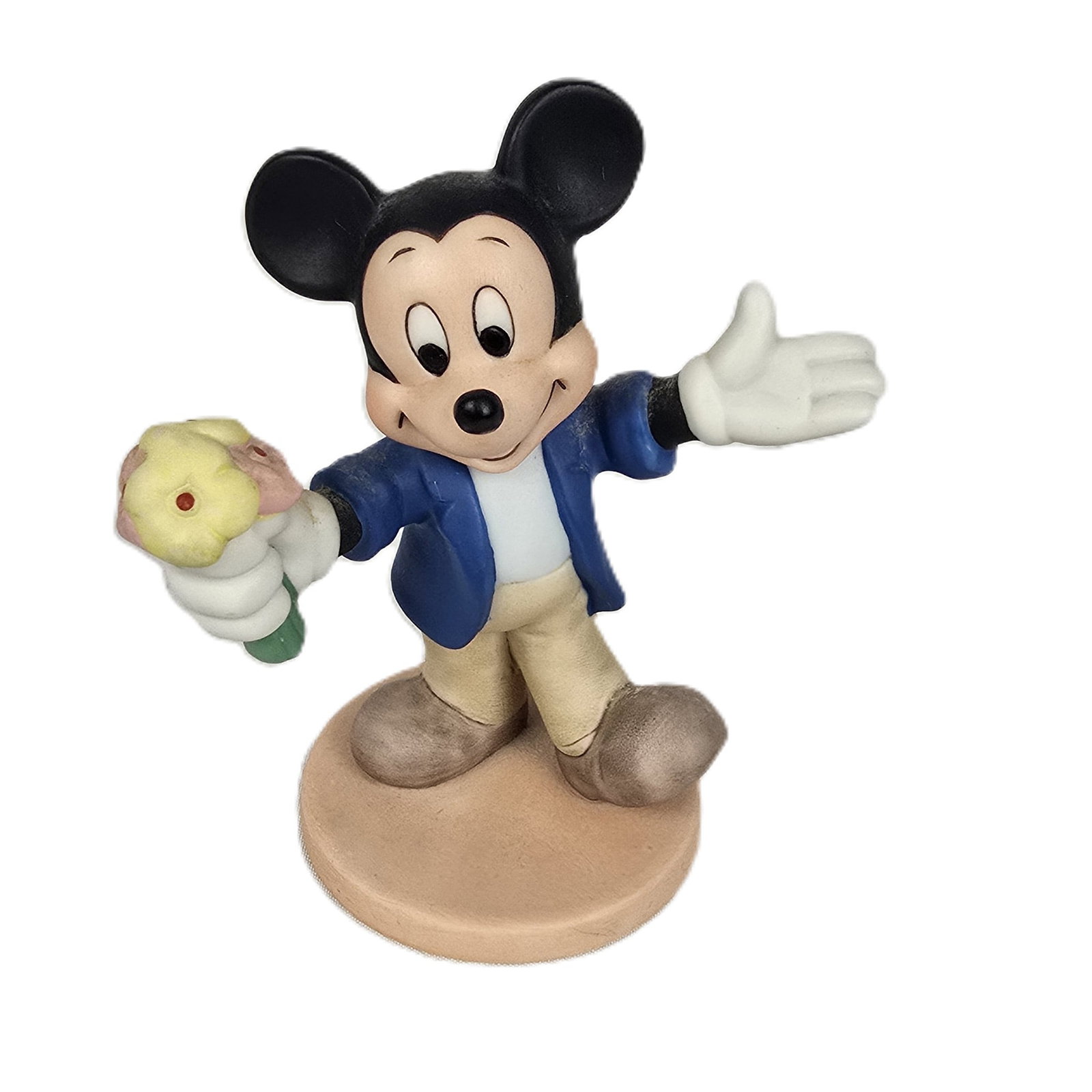 A Porcelain Casual Mickey with Flowers Figurine.: This is a matte painted vintage Mickey Mouse porcelain figurine of Mickey Mouse dressed casually and presenting flowers with open arms. It is made in Sri Lanka and measures 4” tall and 3.5&rdquo