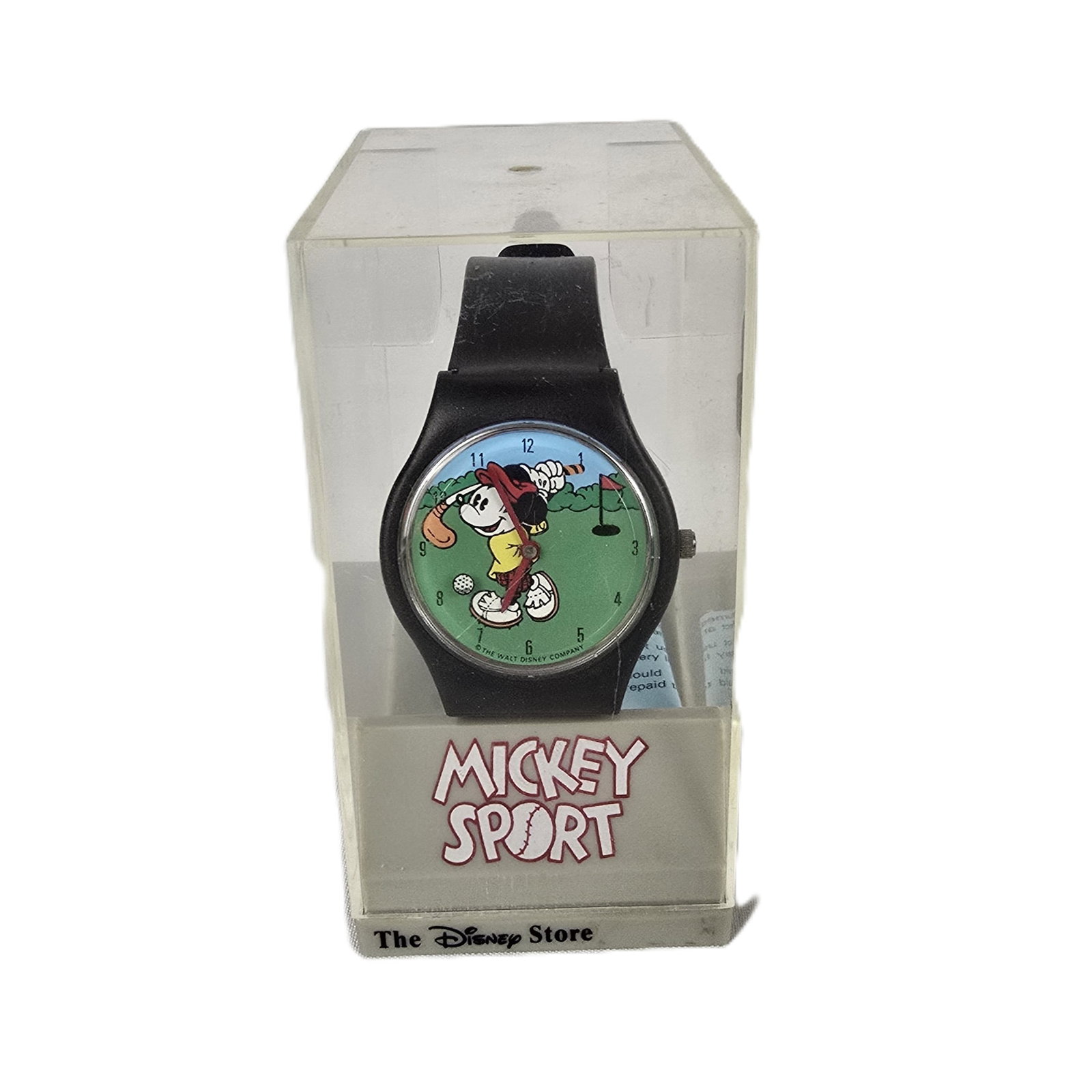 A Golfing Mickey Watch.: (Disney Store) This is a Mickey Sport watch. Mickey is hitting his tee shot in the face of this watch with the flag in sight down the fairway. The seconds are tracked by a golf ball on a clear plastic