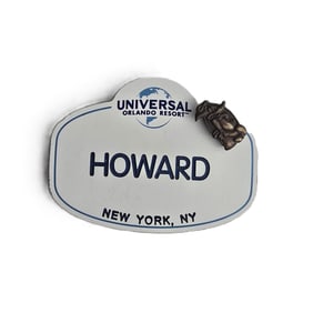 A Universal Studios Team Member Badge With Retired Woody Woodpecker 1 Year Anniversary Pin.