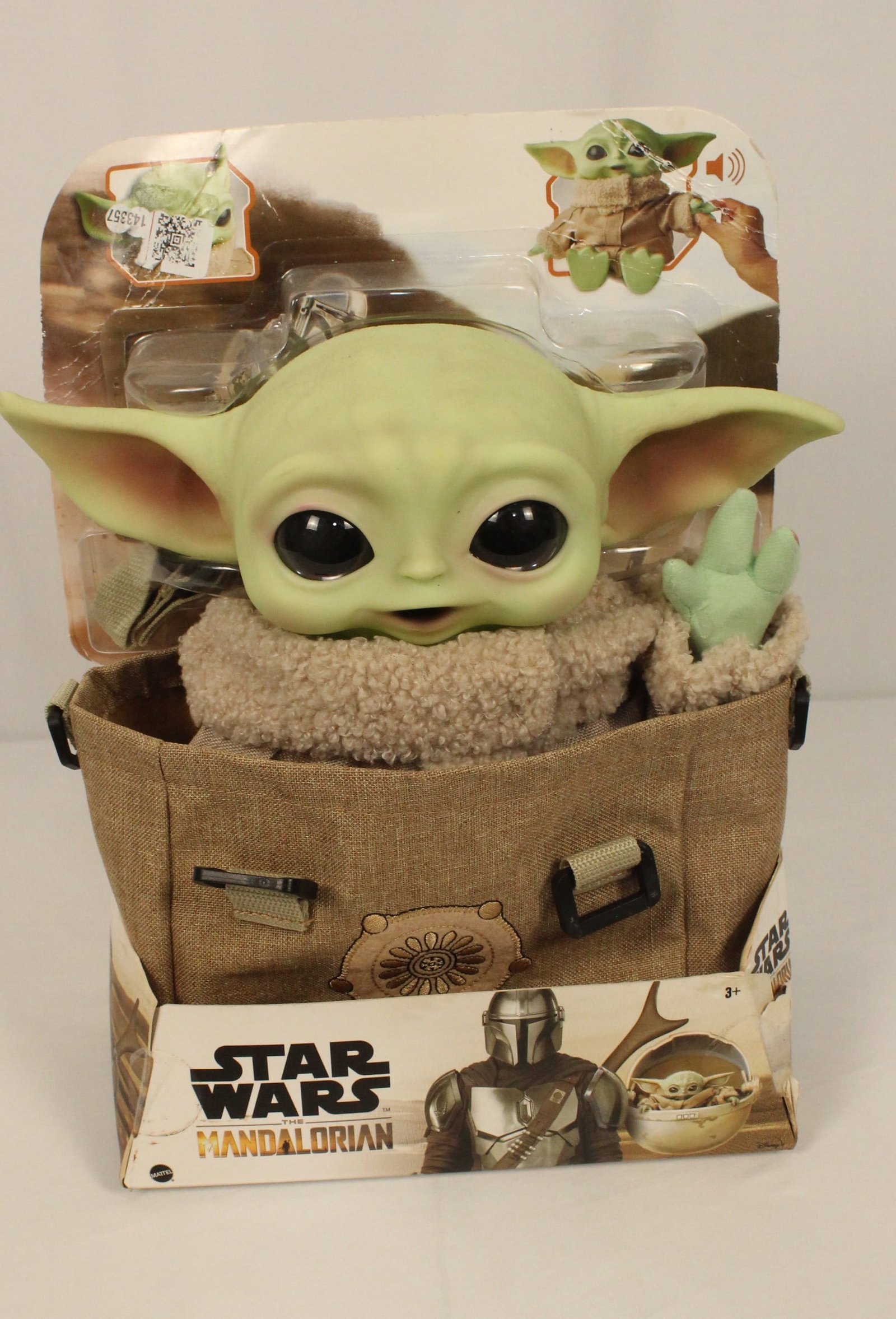 A The Child Premium Talking Plush Bundle.: (Disney) This is a 12 inch premium plush that comes with a carry bag. The packaging has some noted wear but this item is brand new. Squeeze his left hand to have him make sounds like the child.