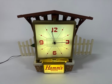 Early 1960s Hamm’s Beet rotating clock with white picket fence.