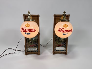Pair of circa 1960s Hamm’s Beer lighted globe wall sconces.