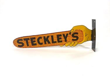 Steckley‘s corn seeds die cut tin flange sign.