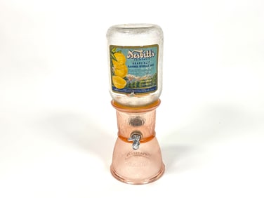 1920s Nesbitt’s Orange Soda fountain glass syrup dispenser.
