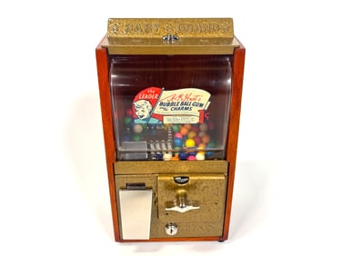 All original 1950s Baby Grand one cent gumball dispenser.
