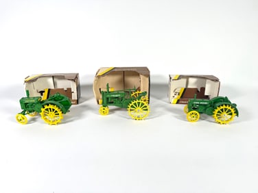 Lot of three John Deer Die-cast tractors by Ertl with boxes