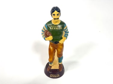 1950s Kessler whiskey football player themed chalk ware bar back display piece.