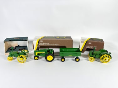 Lot of three John Deere Tractors by Ertl with boxes