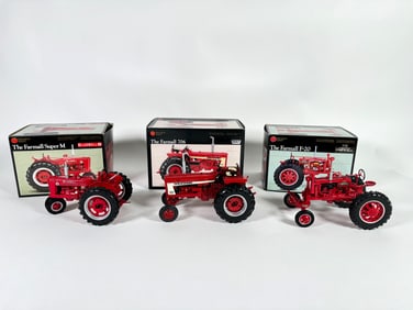 Lot of three Precision Series McCormick Deering Farmall and Deering Farmall Tractors by Ertl with
