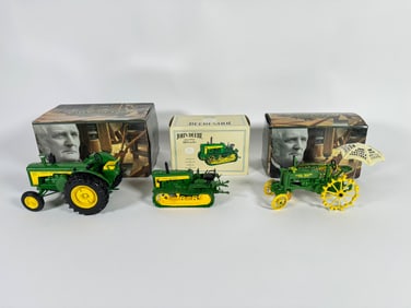 Lot of three John Deere die-cast tractors by Ertl with boxes