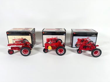 Lot of three Precision Series McCormick Deering Farmall and Deering Farmall Tractors by Ertl with