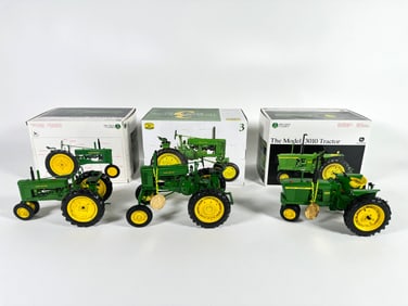 Lot of three John Deere Tractors by Ertl with boxes