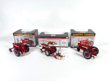 Lot of three International Harvester McCormick Farmall and International tractors by SpecCast with