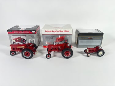 Lot of three Classic Series McCormick Farmall/International Tractors by SpecCast with boxes