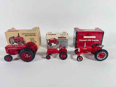 Lot of three McCormick Farmall tractors by Ertl with boxes