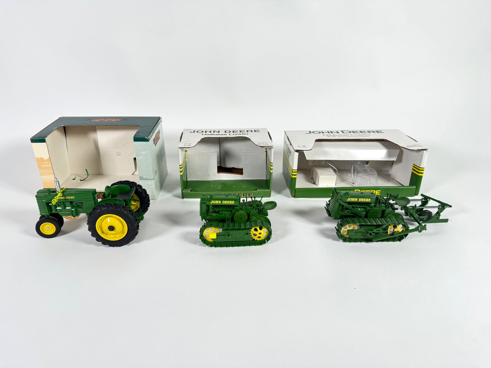 Lot of three John Deere crawlers and tractor by SpecCast with boxes (1 of 2)