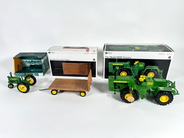 Lot of three John Deere tractors and wagon by Ertl with boxes