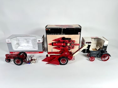 Lot of three McCormick Farmall and McCormick Deering tractors by SpecCast, Ertl and Scale Models