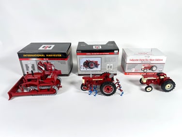 Lot of three International and McCormick Farmall tractors by SpecCast with boxes