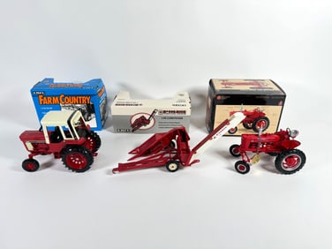 Lot of three International/McCormick Farmall tractors and McCormick Corn Picker by Ertl with boxes