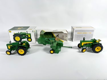 Lot of three John Deere tractors and baler by Ertl with boxes