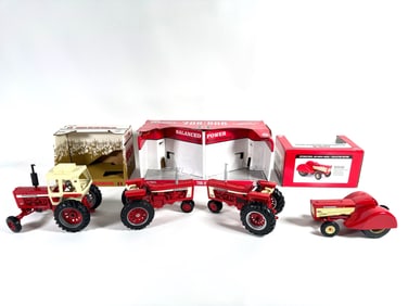 Lot of four International McCormick Farmall tractors by Ertl with boxes