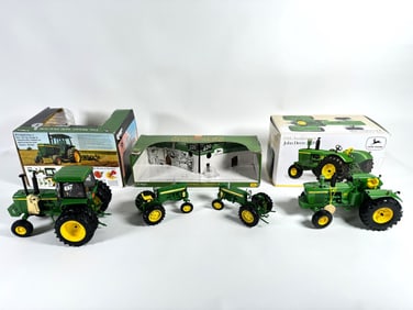 Lot of four John Deere tractors by Ertl with boxes