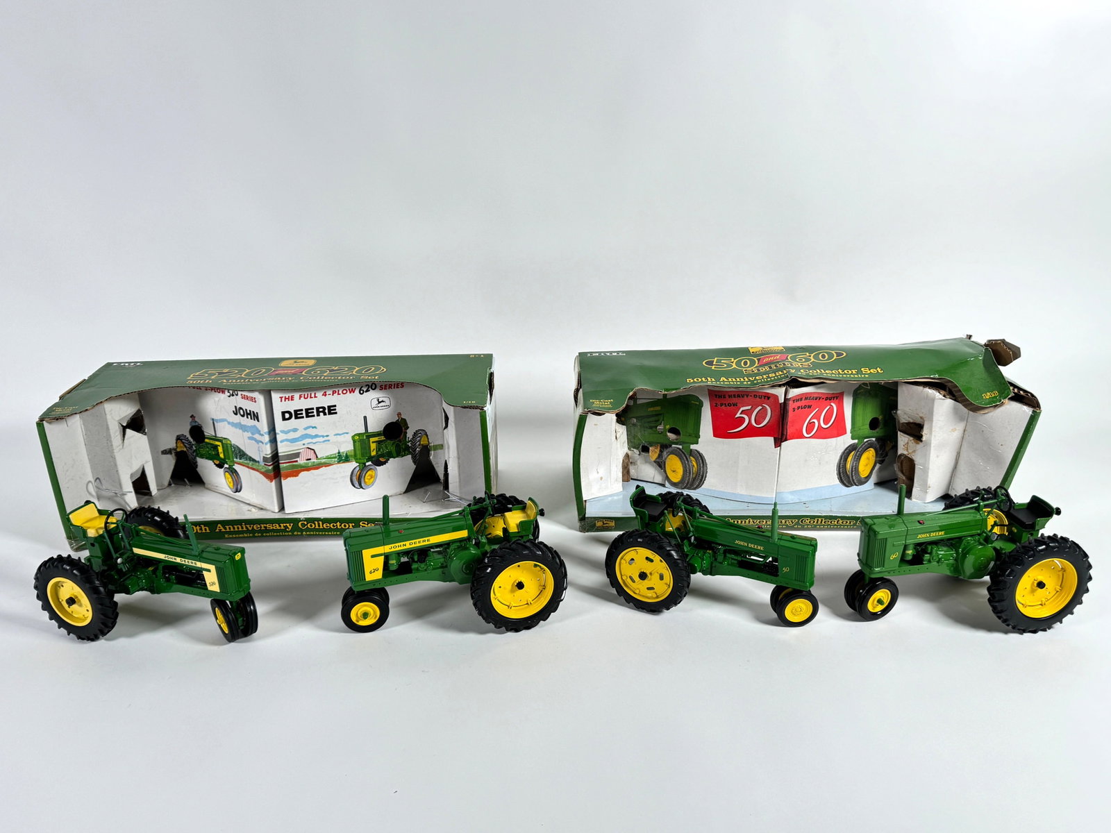 Lot of four John Deere tractors by Ertl with boxes (1 of 2)