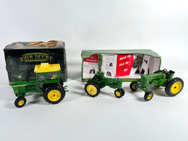 Lot of three John Deere tractors by Ertl with boxes