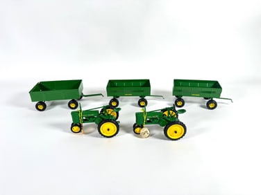 Lot of five John Deere tractors and wagons by Ertl