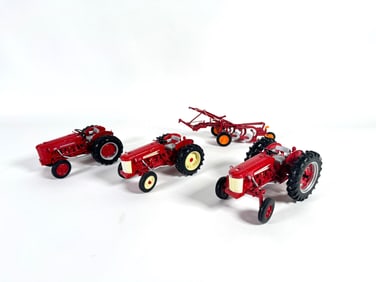 Lot of four International tractors and plow by Ertl