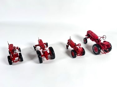 Lot of four McCormick Farmall tractors by Ertl