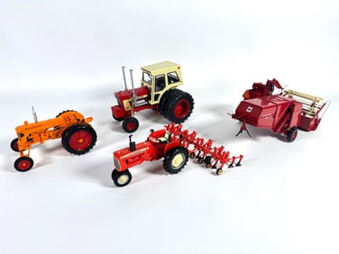 Lot of four tractors and harvester by Ertl