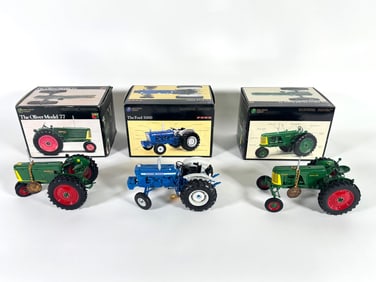 Lot of three Oliver and Ford Precision Series tracotrs by Ertl with boxes