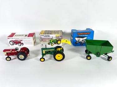 Lot of three International, John Deere and Farm Country tractors and wagon by Ertl with boxes
