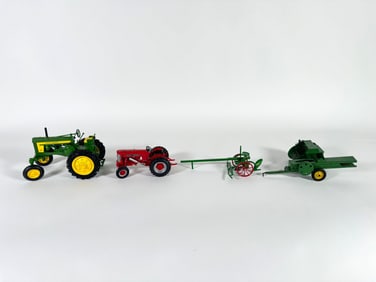 Lot of four John Deere tractors and towable accessories