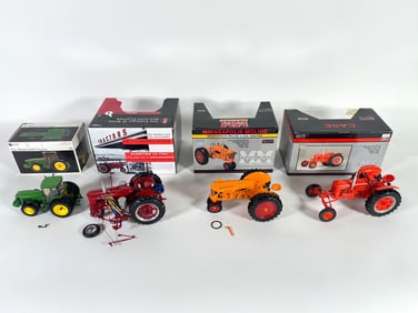 Lot of four tractors by Ertl and SpecCast with boxes