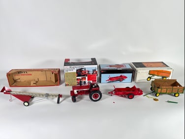 Lot of four tractors, elevator and wagon by Ertl with boxes