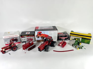 Lot of five International and John Deere tractors by Ertl and SpecCast with boxes